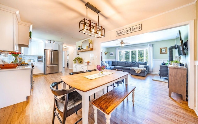 1731 Rte 47, Eldora, NJ 08270 - dining space with light wood-type flooring, a ceiling fan, and crown molding