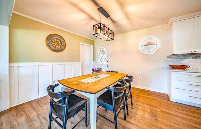 1731 Rte 47, Eldora, NJ 08270 - dining room with light wood-type flooring, crown molding, wainscoting, and a chandelier