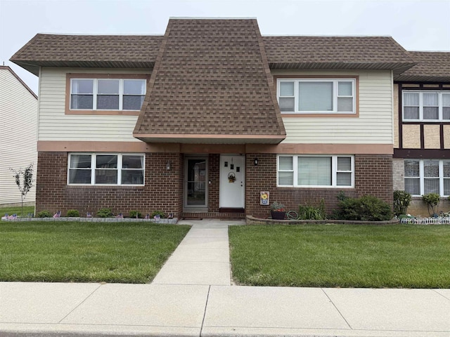 1964 E Oak Rd, Vineland, NJ 08360 - view of front facade with a shingled roof, a front yard, and brick siding