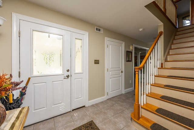 entrance foyer with light tile patterned floors