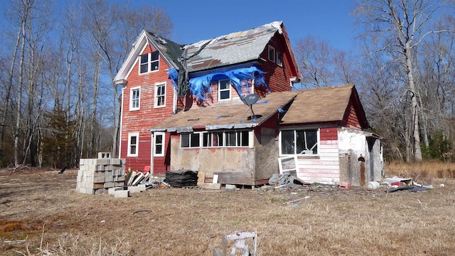 view of front of home featuring a shingled roof