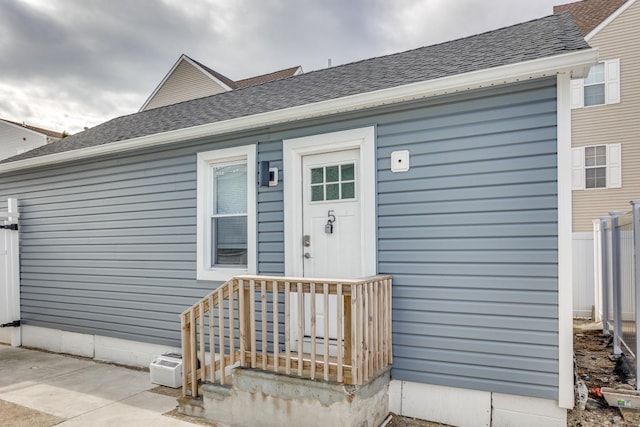 222 E Burk Ave Unit 5, Wildwood, NJ 08260 - property entrance with roof with shingles and fence