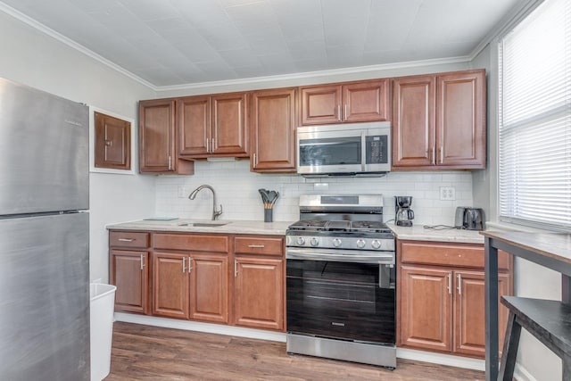 222 E Burk Ave Unit 5, Wildwood, NJ 08260 - kitchen featuring a sink, backsplash, appliances with stainless steel finishes, and wood finished floors