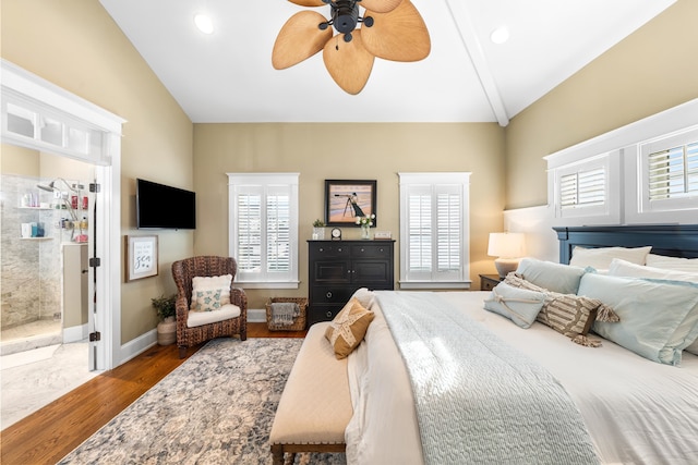 243 110th St, Stone Harbor, NJ 08247 - bedroom with lofted ceiling, multiple windows, wood finished floors, a ceiling fan, and ensuite bathroom
