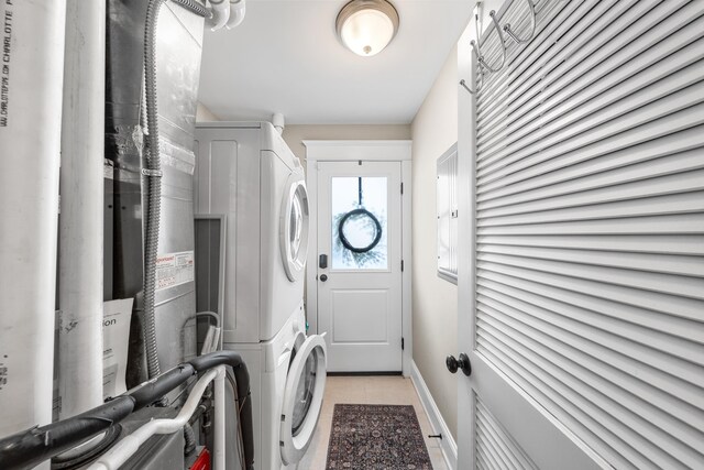 243 110th St, Stone Harbor, NJ 08247 - washroom with estacked washer and dryer and baseboards