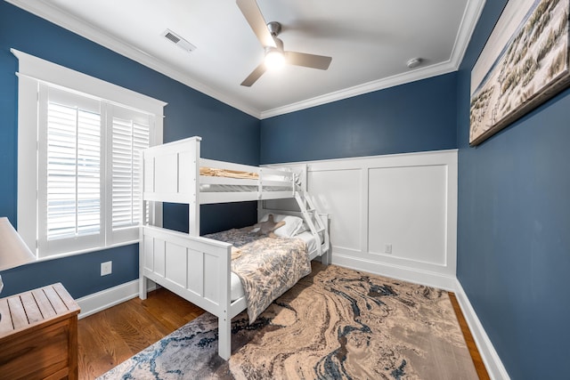 243 110th St, Stone Harbor, NJ 08247 - bedroom with ornamental molding, wood finished floors, and a ceiling fan
