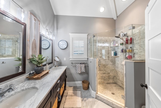 243 110th St, Stone Harbor, NJ 08247 - full bathroom with double vanity, a shower stall, and vaulted ceiling