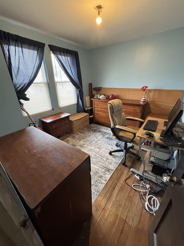 office space with wood-type flooring