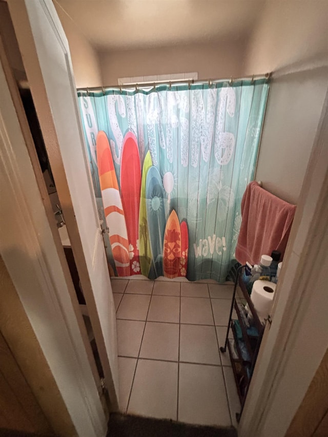 bathroom with tile patterned floors