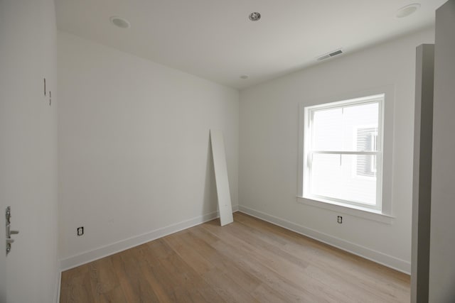 unfurnished room featuring light hardwood / wood-style flooring