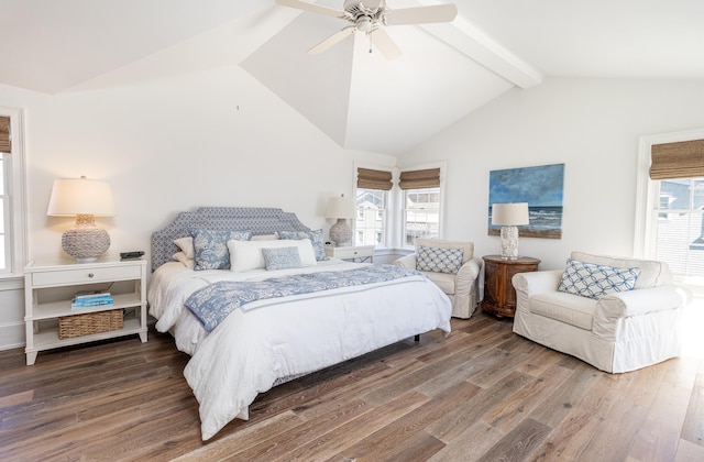 bedroom featuring multiple windows, hardwood / wood-style floors, vaulted ceiling with beams, and ceiling fan