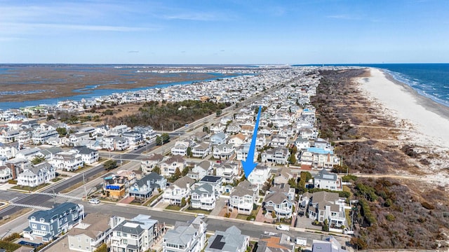 bird's eye view featuring a beach view and a water view