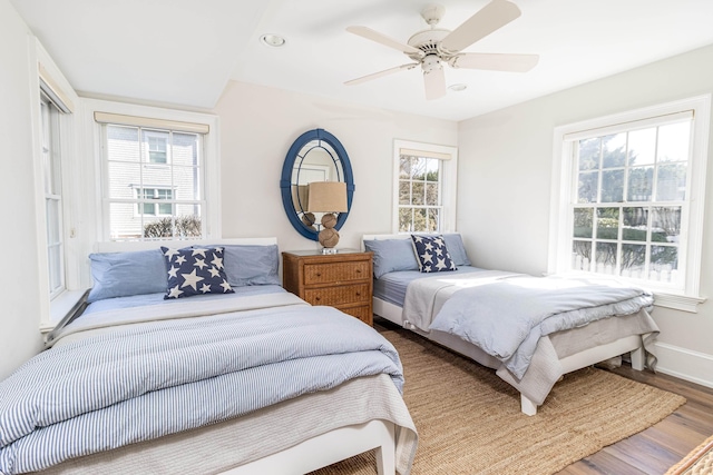 bedroom with wood-type flooring and ceiling fan