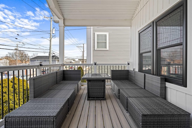 wooden terrace with outdoor lounge area