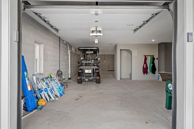 garage with concrete block wall