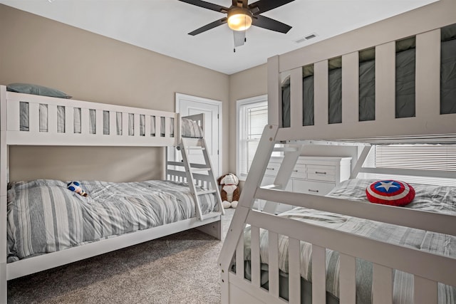 bedroom featuring ceiling fan, carpet floors, and visible vents