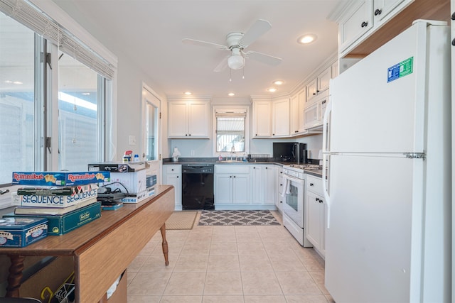 kitchen with white appliances, ceiling fan, sink, white cabinets, and light tile patterned flooring