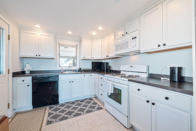 kitchen featuring white cabinetry, white appliances, sink, and light tile patterned floors