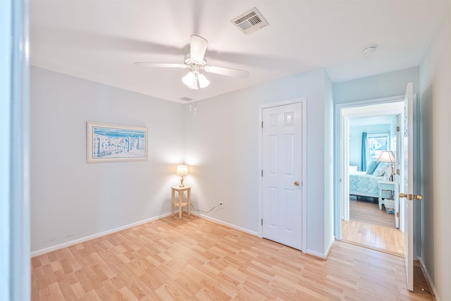 spare room with ceiling fan and light hardwood / wood-style flooring