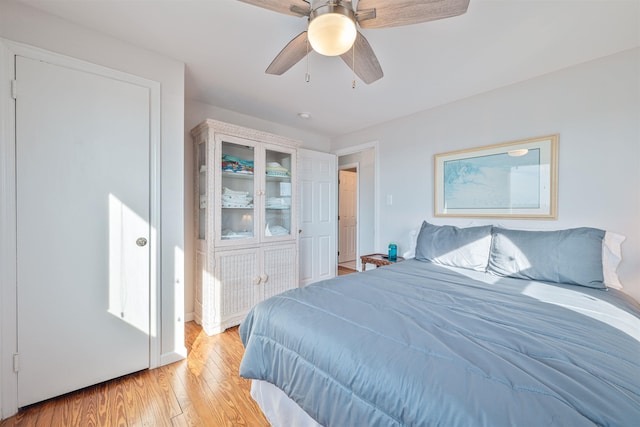 bedroom featuring ceiling fan and light hardwood / wood-style flooring