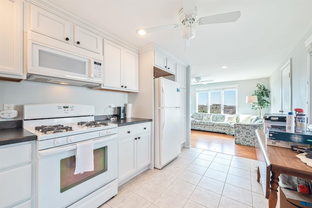 kitchen with white cabinetry, light tile patterned flooring, white appliances, and ceiling fan