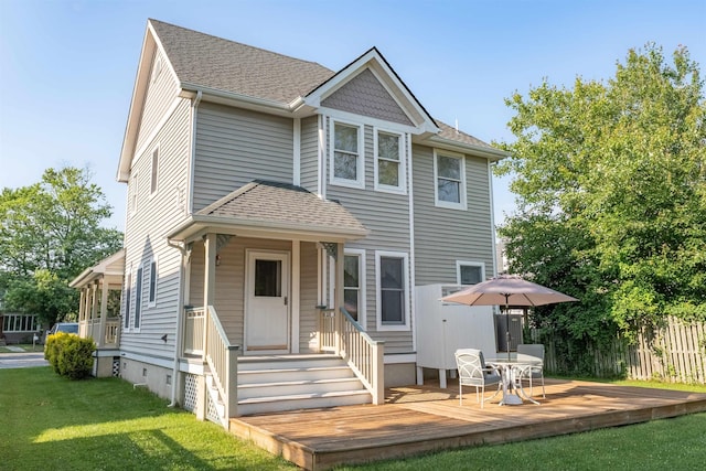 119 Stevens St, West Cape May, NJ 08204 - back of property with roof with shingles and a wooden deck