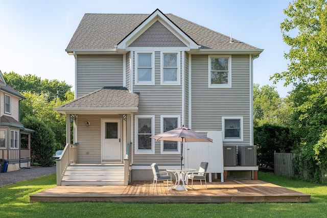 119 Stevens St, West Cape May, NJ 08204 - back of property featuring a deck, a lawn, and roof with shingles