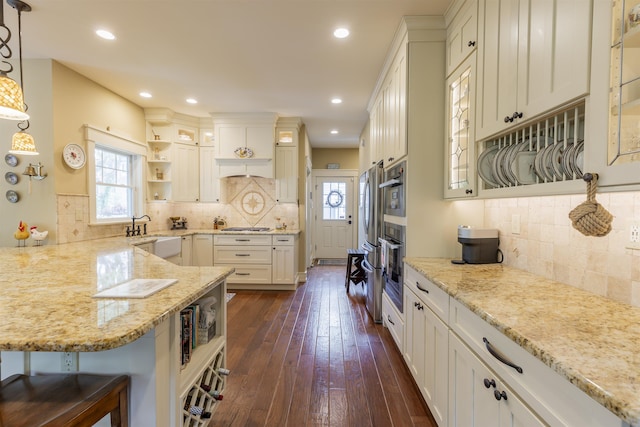 310 Brainard Ave, Cape May Point, NJ 08212 - kitchen featuring open shelves, a sink, a peninsula, healthy amount of natural light, and recessed lighting