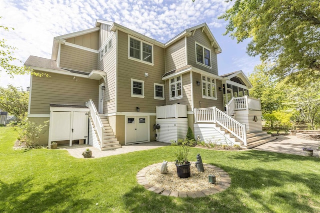 310 Brainard Ave, Cape May Point, NJ 08212 - back of house featuring stairs, a patio area, and a yard