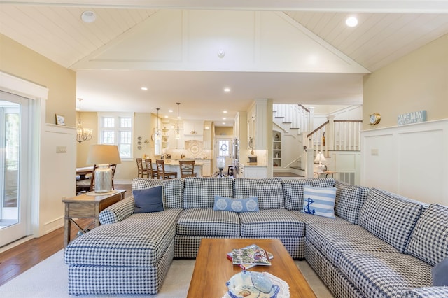 310 Brainard Ave, Cape May Point, NJ 08212 - living room with vaulted ceiling, light wood-style floors, stairway, and recessed lighting