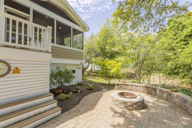 310 Brainard Ave, Cape May Point, NJ 08212 - view of patio featuring a sunroom and an outdoor fire pit