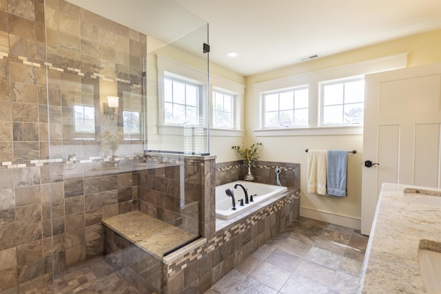 310 Brainard Ave, Cape May Point, NJ 08212 - bathroom featuring a bath, a tile shower, baseboards, stone finish flooring, and recessed lighting