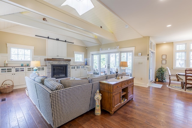 310 Brainard Ave, Cape May Point, NJ 08212 - living room featuring dark wood-style flooring, a skylight, healthy amount of natural light, and recessed lighting