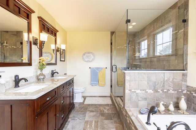 310 Brainard Ave, Cape May Point, NJ 08212 - full bathroom featuring a shower stall, baseboards, double vanity, toilet, and a relaxing tiled tub