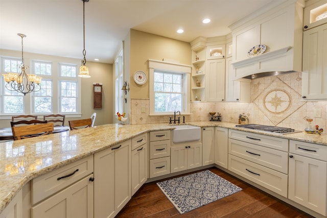310 Brainard Ave, Cape May Point, NJ 08212 - kitchen featuring a sink, stainless steel gas cooktop, a chandelier, dark wood-style flooring, and pendant lighting