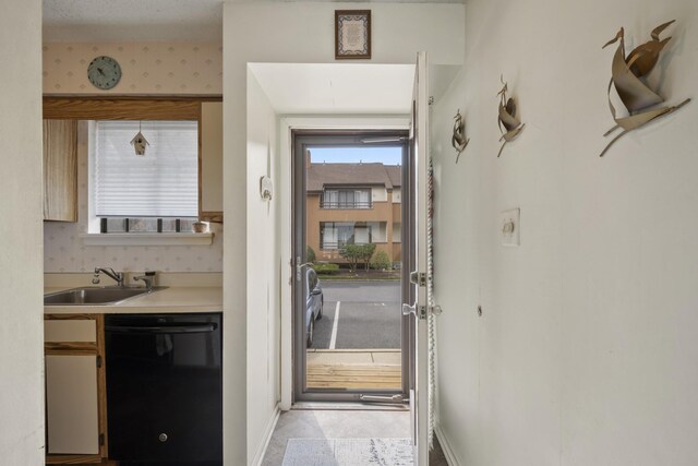 14 Genoa Ct Unit 14, Ocean City, NJ 08226 - doorway to outside with baseboards and a sink
