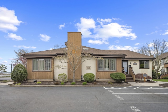 14 Genoa Ct Unit 14, Ocean City, NJ 08226 - view of front of home featuring a chimney and uncovered parking