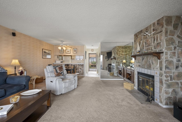 14 Genoa Ct Unit 14, Ocean City, NJ 08226 - carpeted living area featuring wallpapered walls, a stone fireplace, a textured ceiling, and ceiling fan
