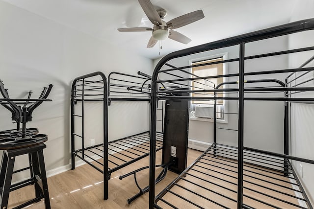 bedroom featuring ceiling fan and light hardwood / wood-style floors