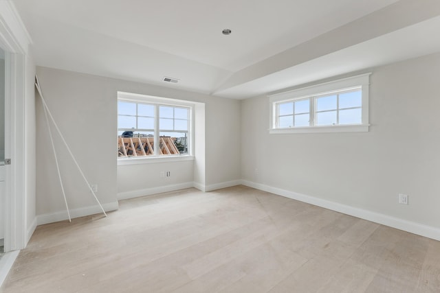 unfurnished room with a healthy amount of sunlight and light wood-type flooring