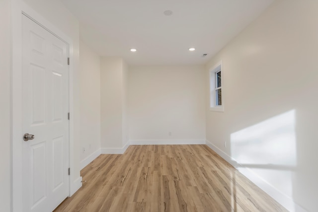 spare room with light hardwood / wood-style floors