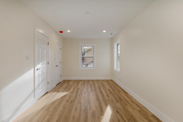 spare room featuring light wood-type flooring