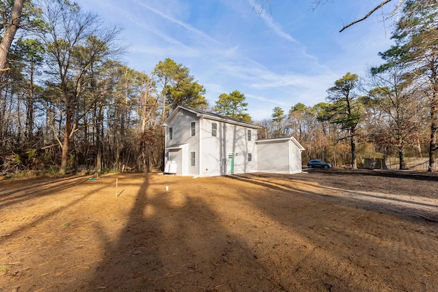 view of side of property with a garage