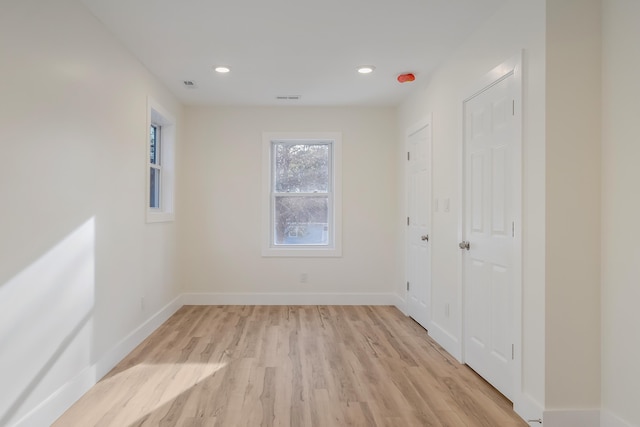 spare room with light hardwood / wood-style floors