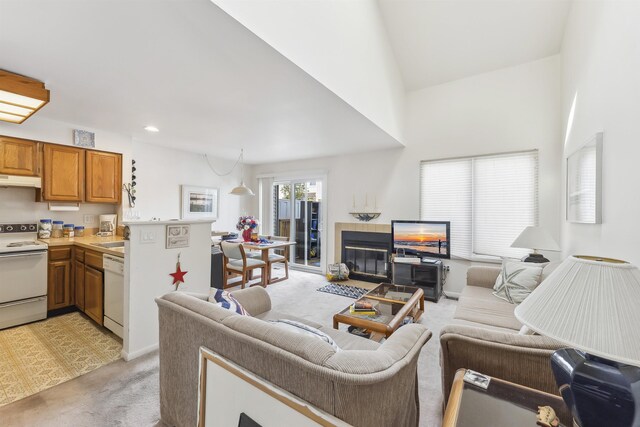 111 Austin Ave Unit 111, Lower Township, NJ 08260 - living room featuring light carpet, a tile fireplace, recessed lighting, and a towering ceiling