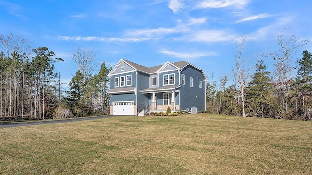 front of property with central AC, a garage, and a front lawn