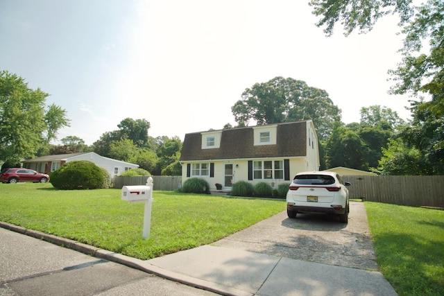 cape cod-style house with a front yard