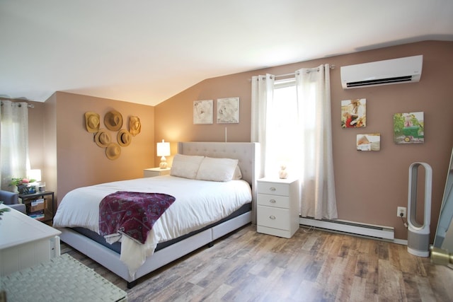 bedroom featuring hardwood / wood-style flooring, lofted ceiling, an AC wall unit, and a baseboard heating unit