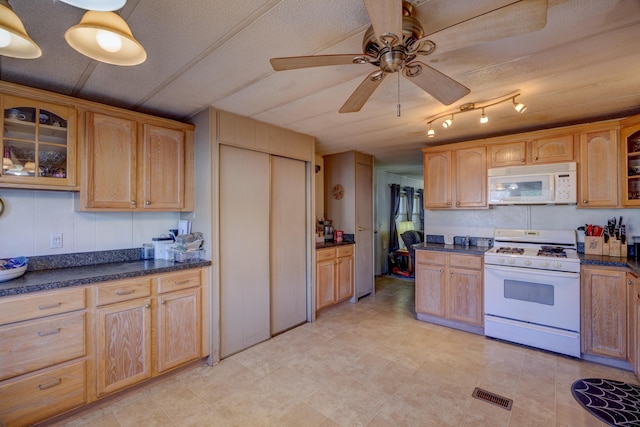 kitchen with visible vents, white appliances, glass insert cabinets, and ceiling fan