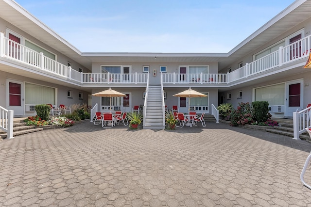 view of property's community featuring a patio area